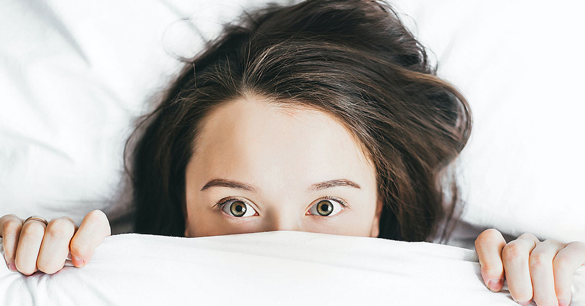 unique-voice-of-asset-managers person hiding under the sheets